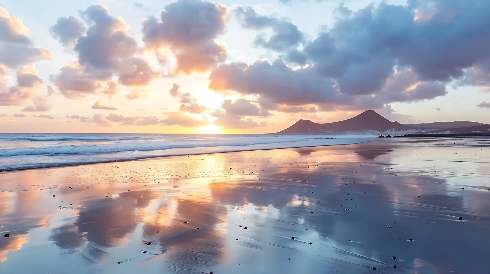 Majestic sunset illuminating Famara beach — free download from Dotvec