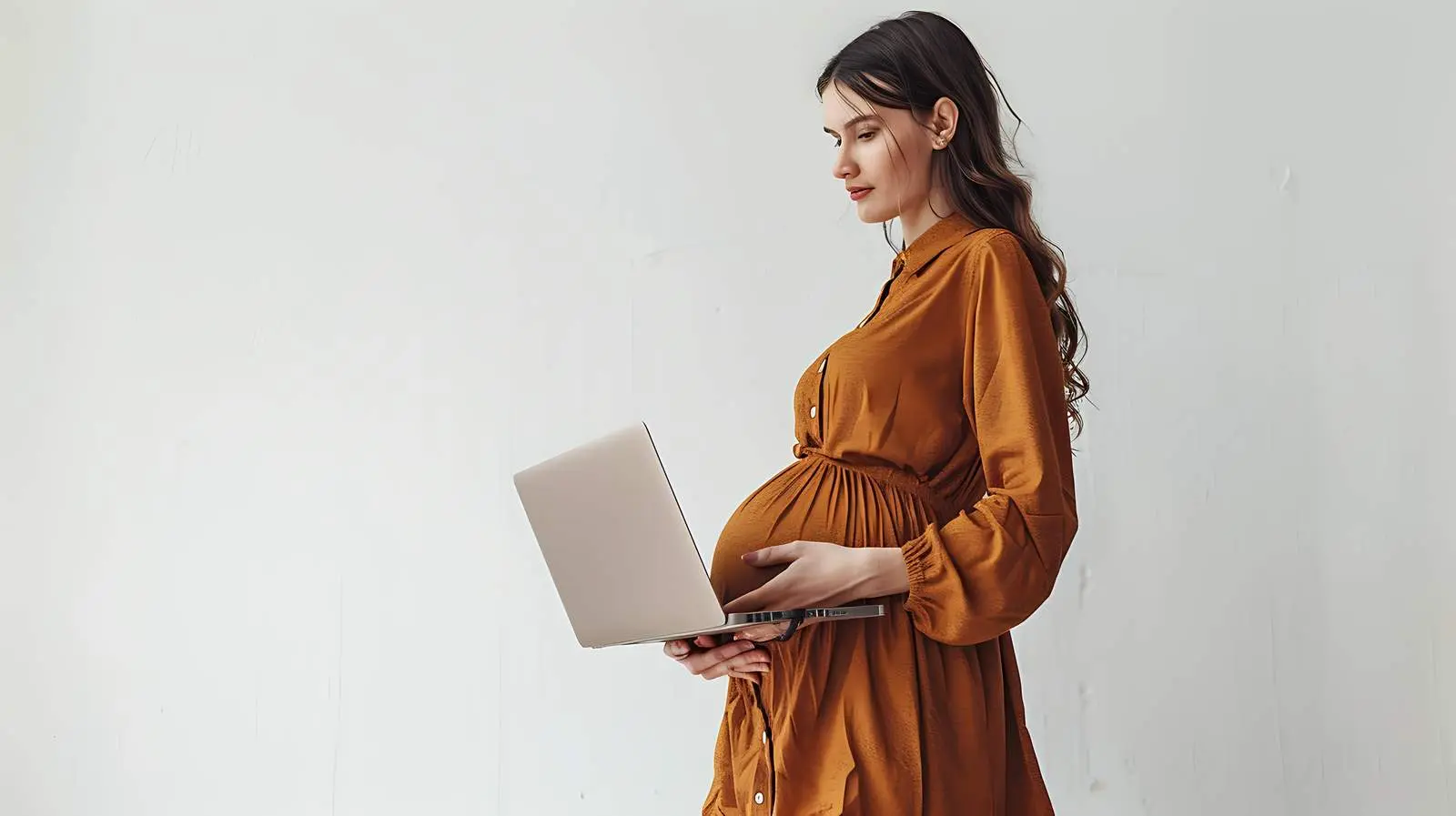 Pregnant Woman in Brown Dress with Laptop — free download from Dotvec