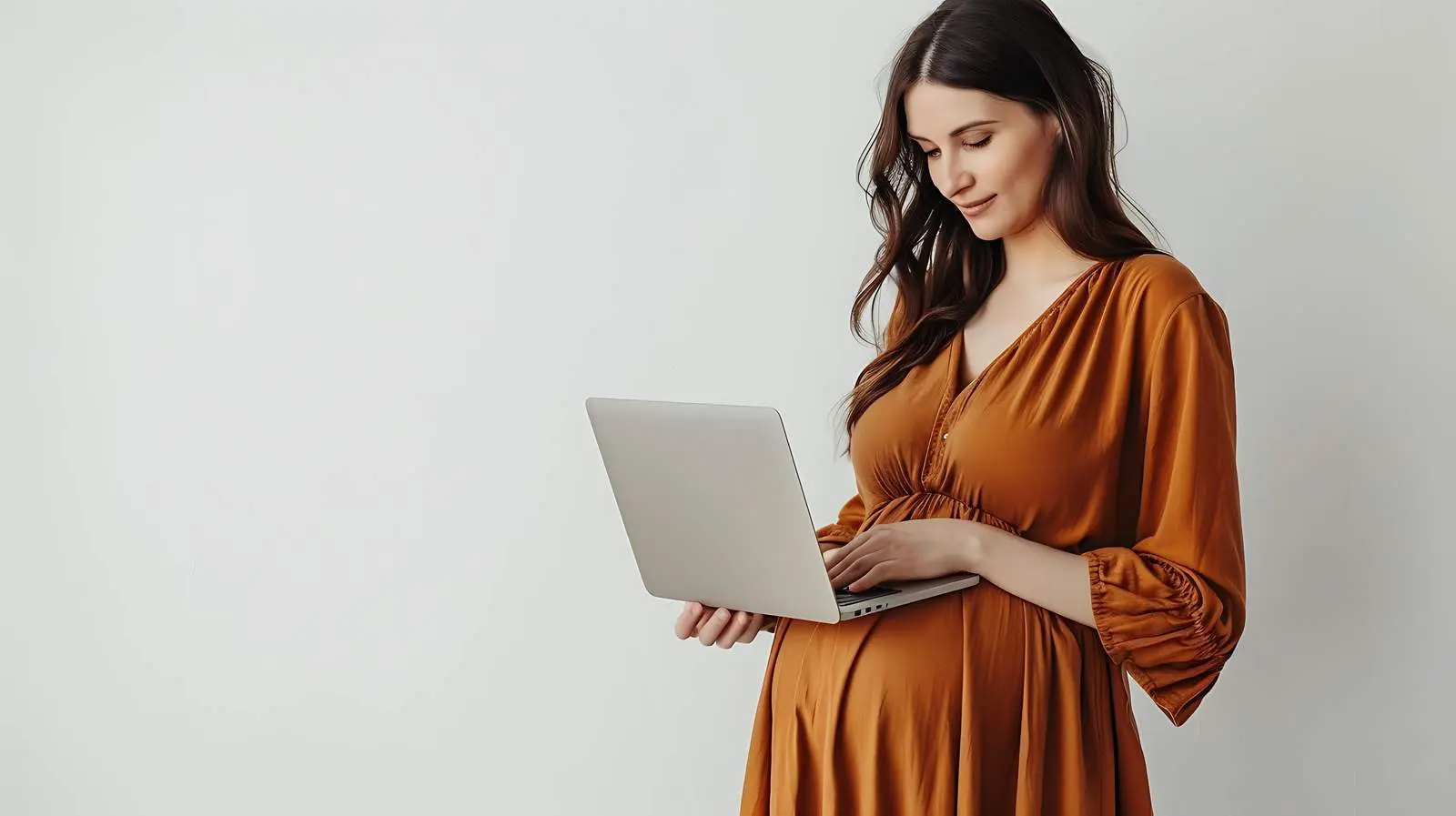 Young Pregnant Woman Working on Laptop — free download from Dotvec