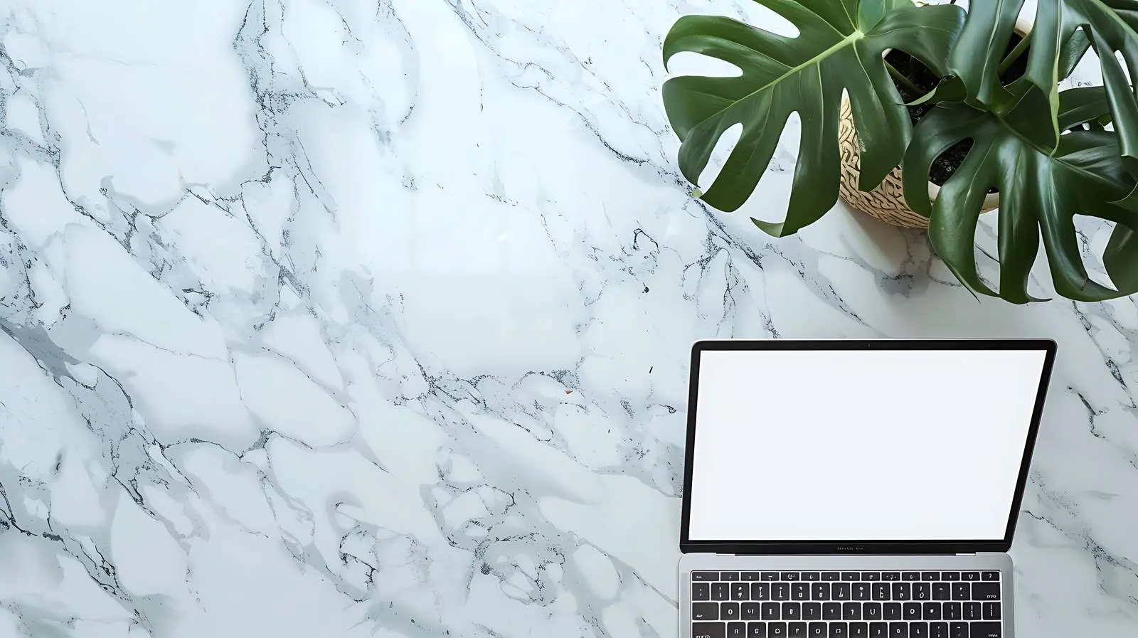 Laptop on Marble Table with Blank Screen — free download from Dotvec