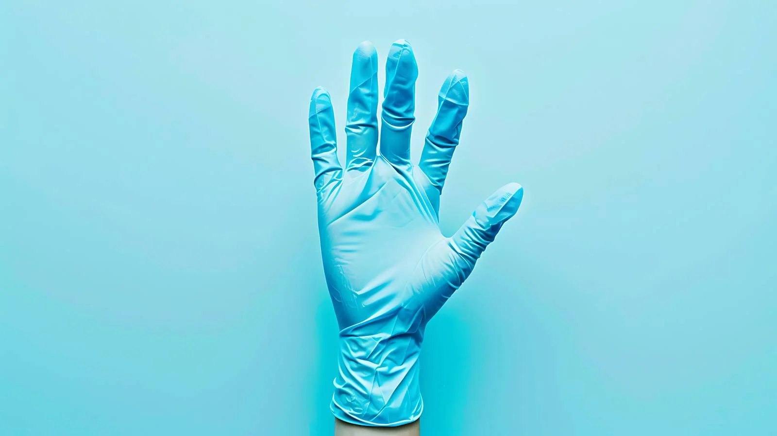 Blue Latex Medical Glove on Pastel Blue — free download from Dotvec