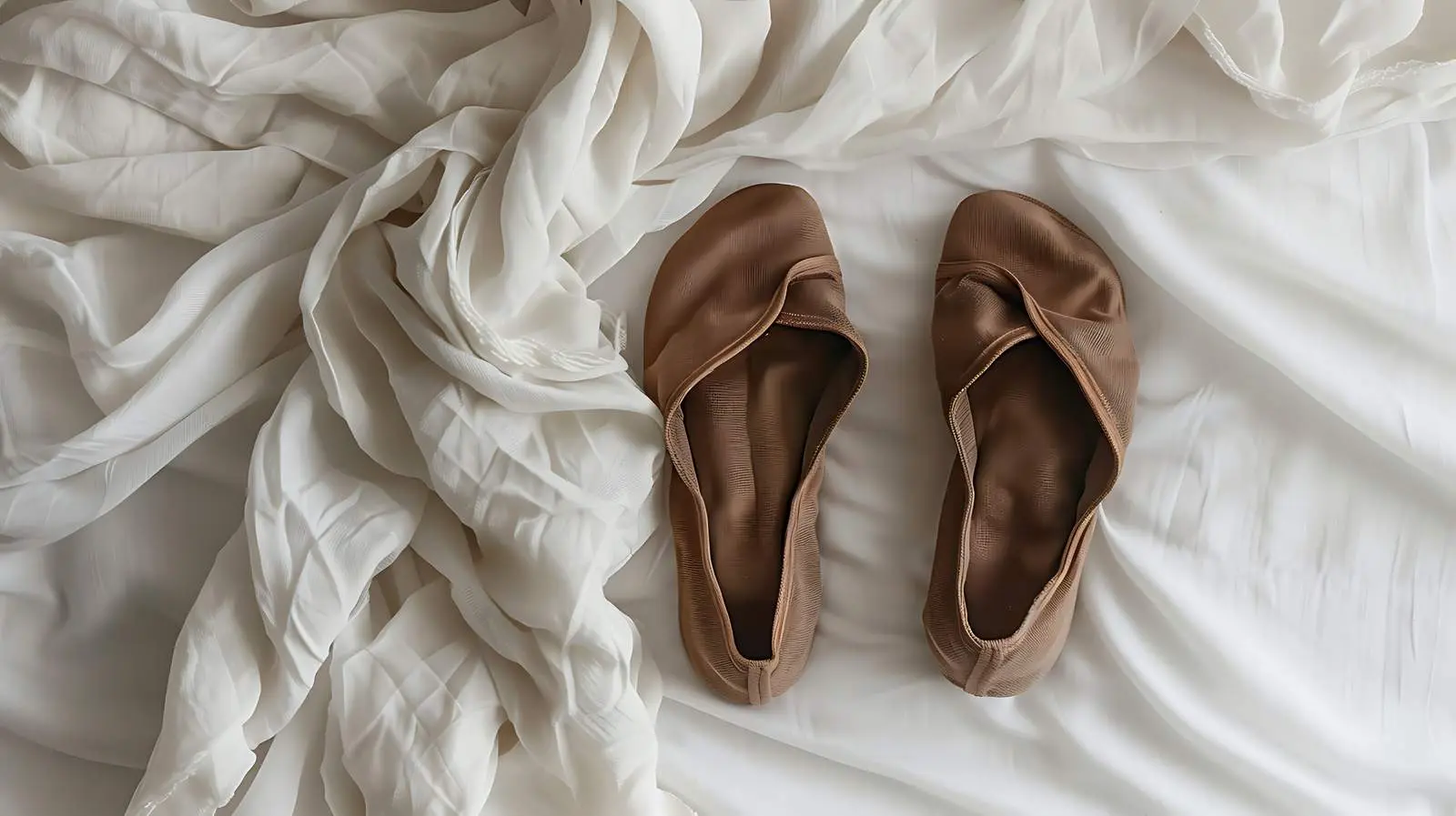 Cozy Brown Slippers on Crumpled White Linen – free soft materials image from Dotvec