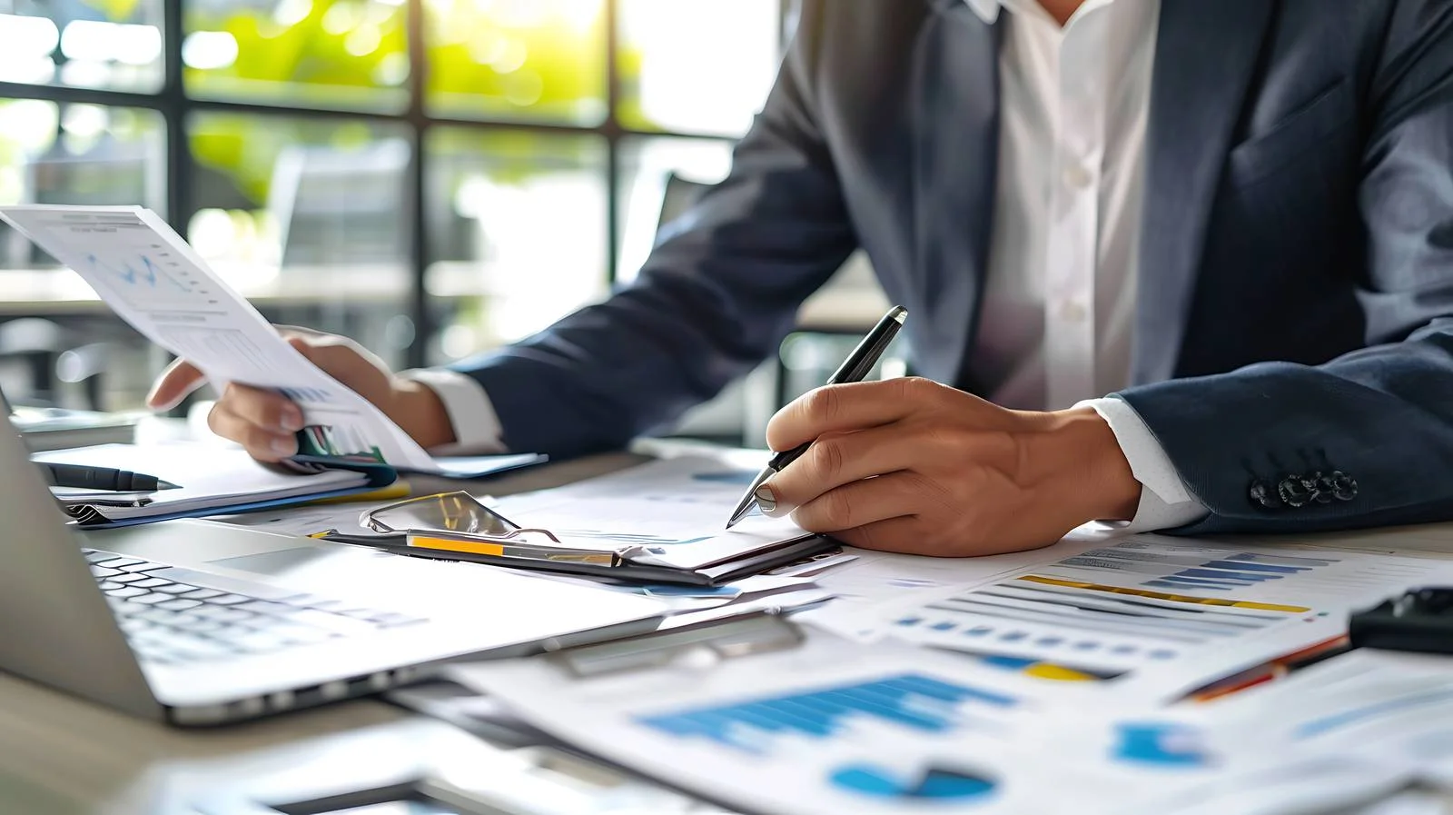 Businessman Analyzing on Office Desk — free download from Dotvec