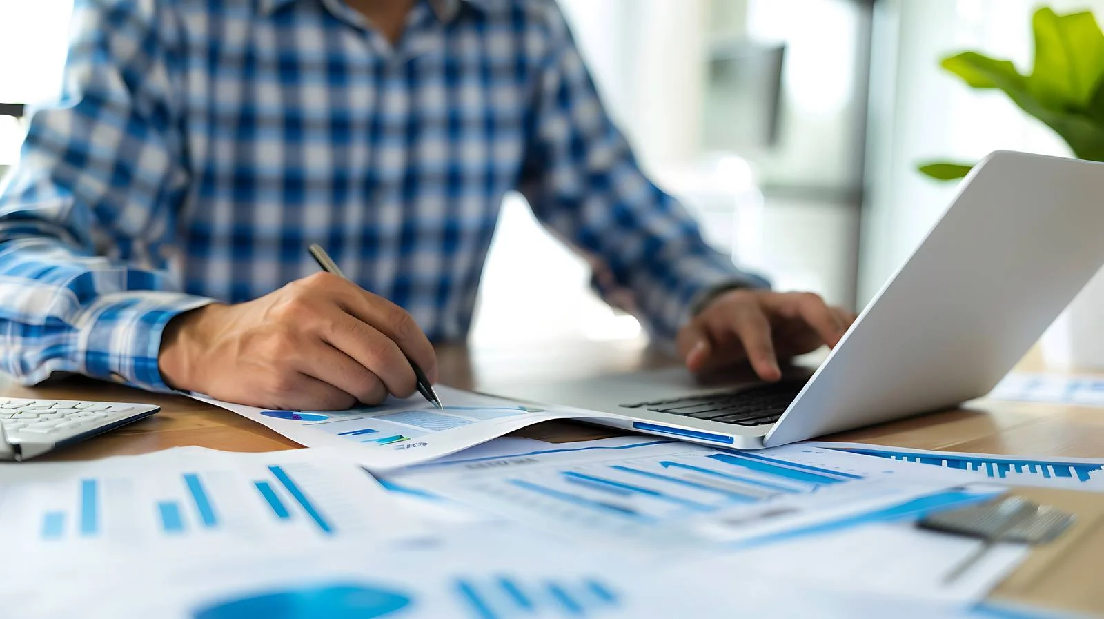 Businessman Analyzing Work on Office Desk — free download from Dotvec