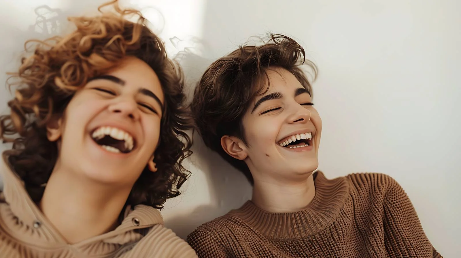 Joyful queer couple enjoying playful laughter — free download from Dotvec