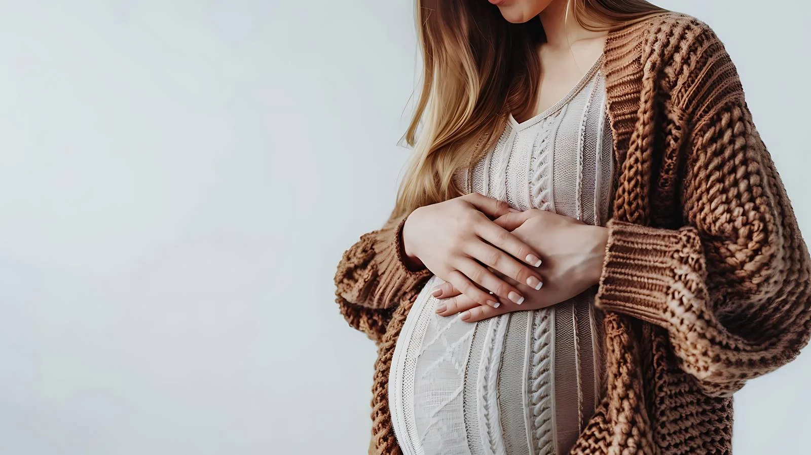 Pregnant Woman Touching Belly Close-up — free download from Dotvec