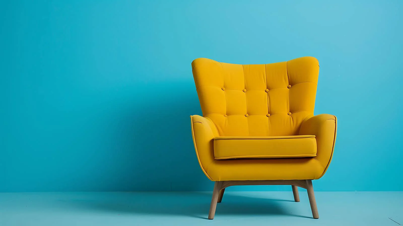 Cozy Yellow Armchair Blue Wall Background — free download from Dotvec