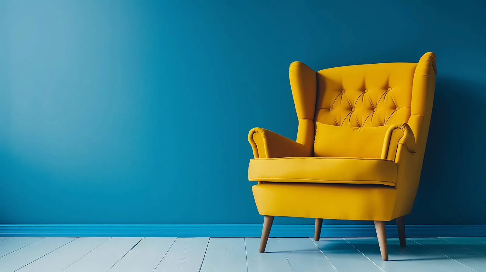 Elegant Yellow Armchair Blue Wall Background — free download from Dotvec