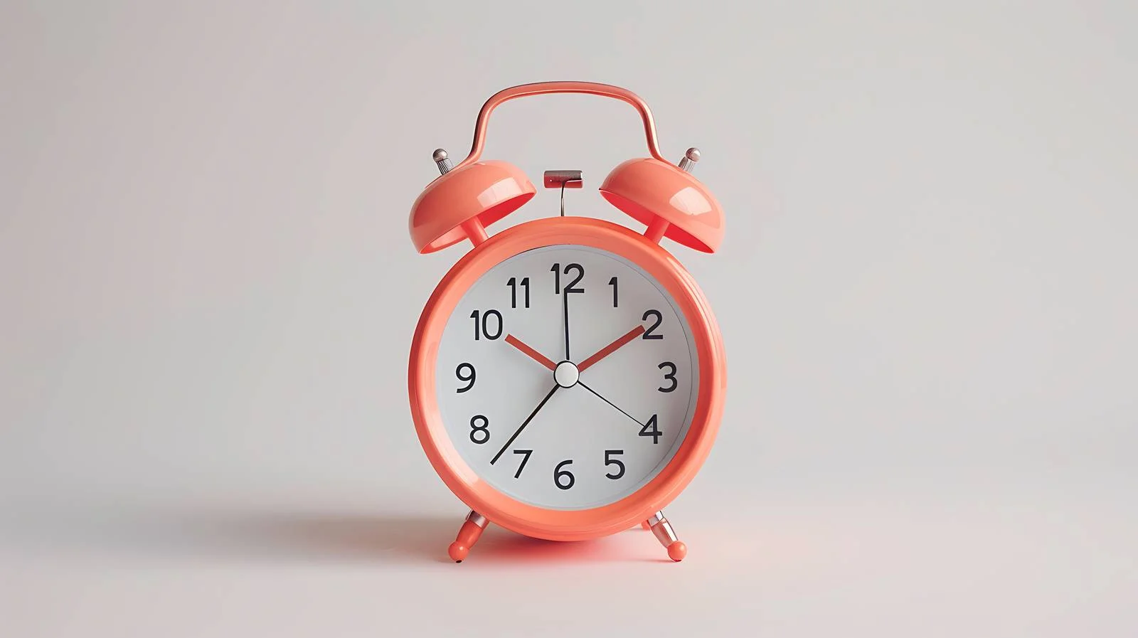 Vibrant Coral Alarm Clock on Bright Background — free download from Dotvec