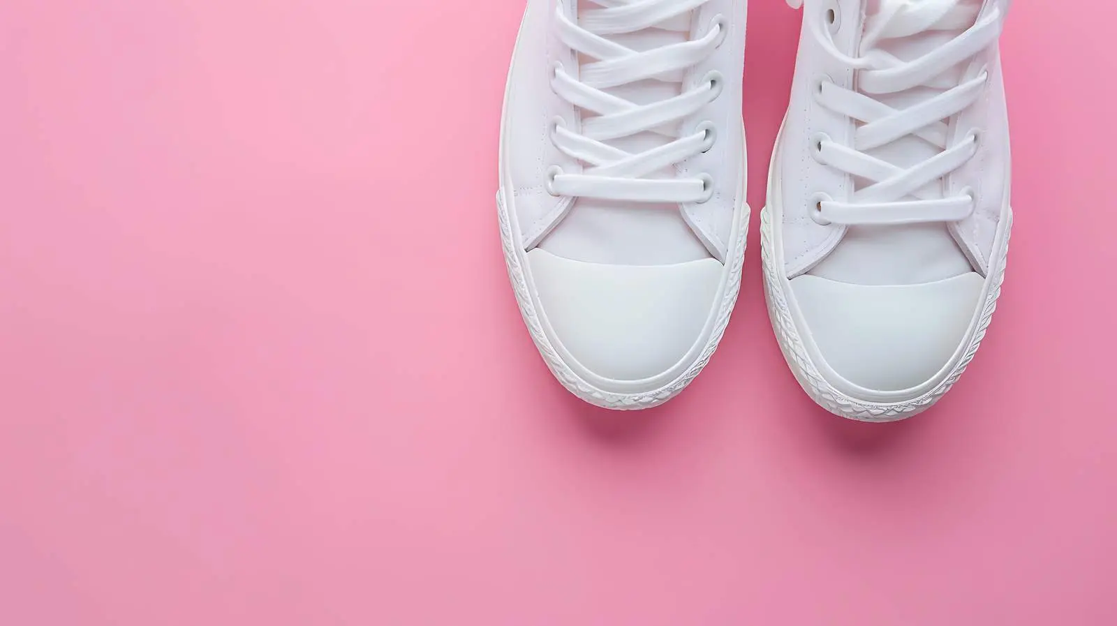 Stylish White Women's Sneakers on Pink Background – free young image from Dotvec