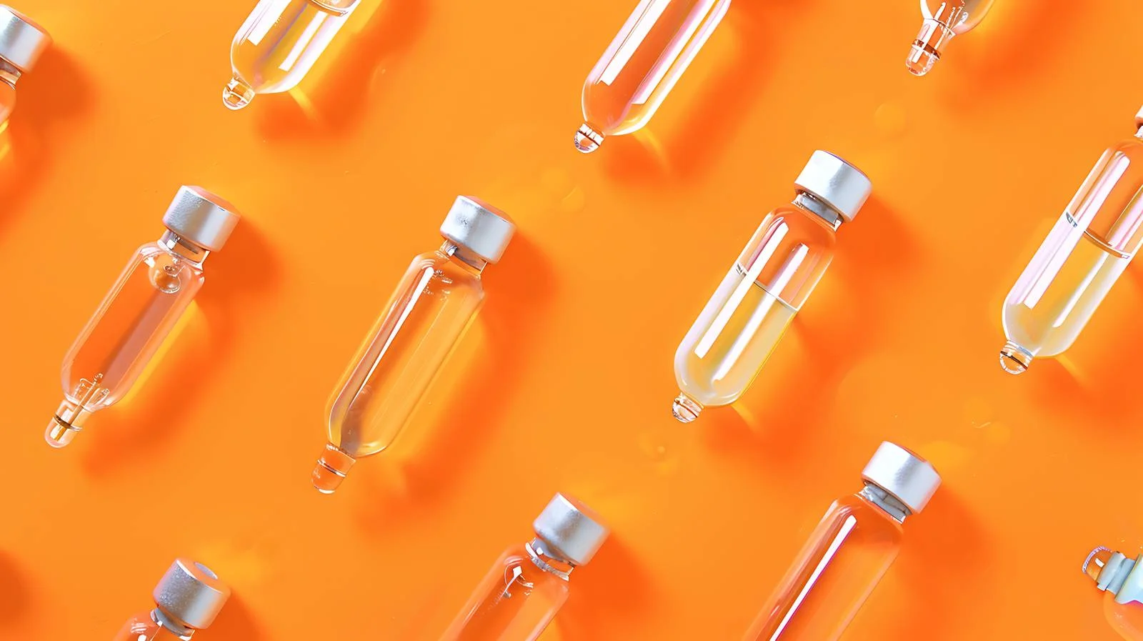 Medical Glass Ampules on Orange Background — free download from Dotvec