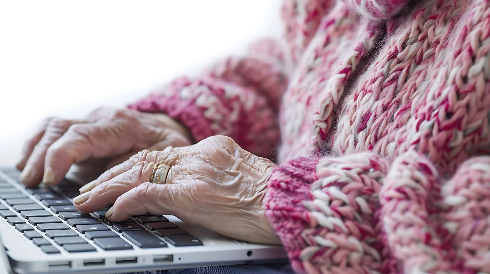 Senior Woman Typing on Laptop Keyboard — free download from Dotvec