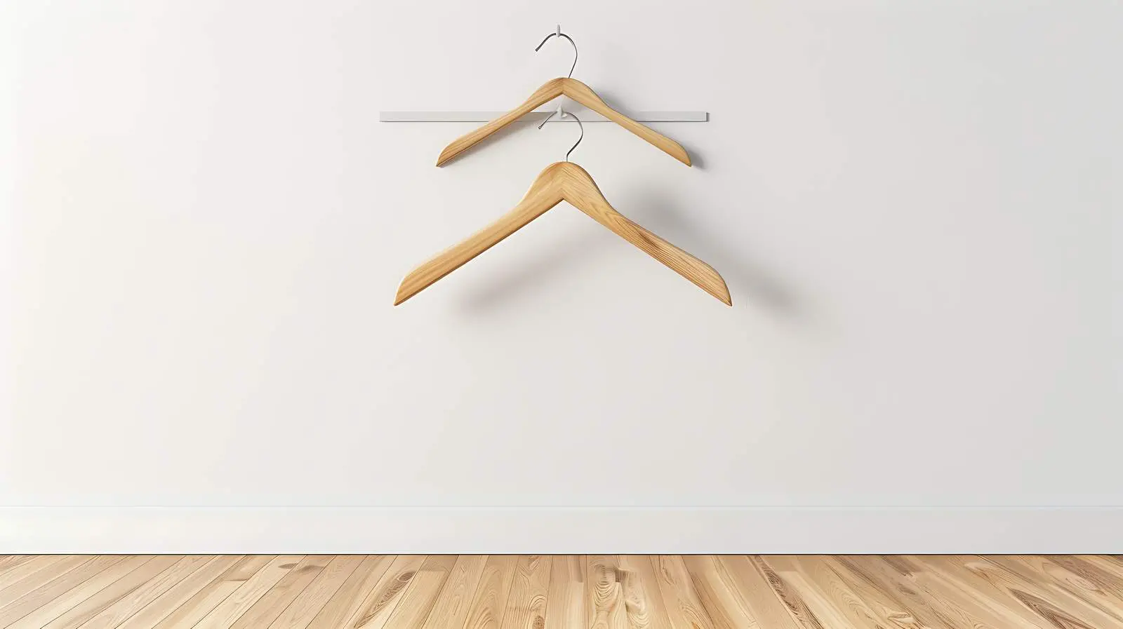 Minimalist Hangers on Wooden Floor by White Wall — free download from Dotvec