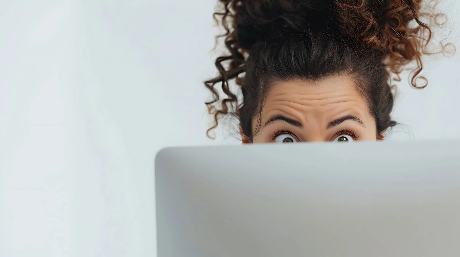 Curious Woman Behind Computer Screen — free download from Dotvec