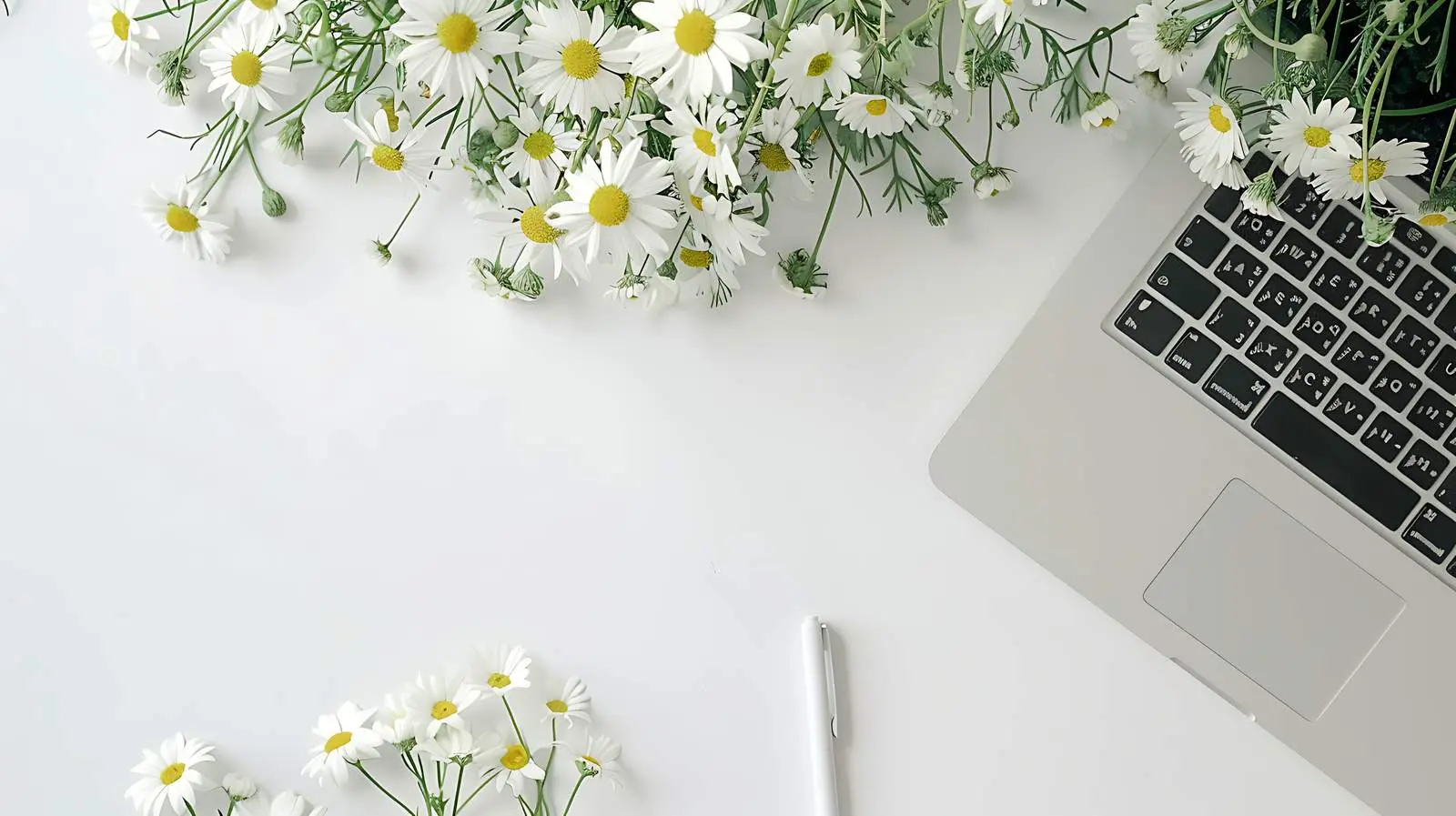Cozy Home Office Desk with Laptop and Flowers — free download from Dotvec
