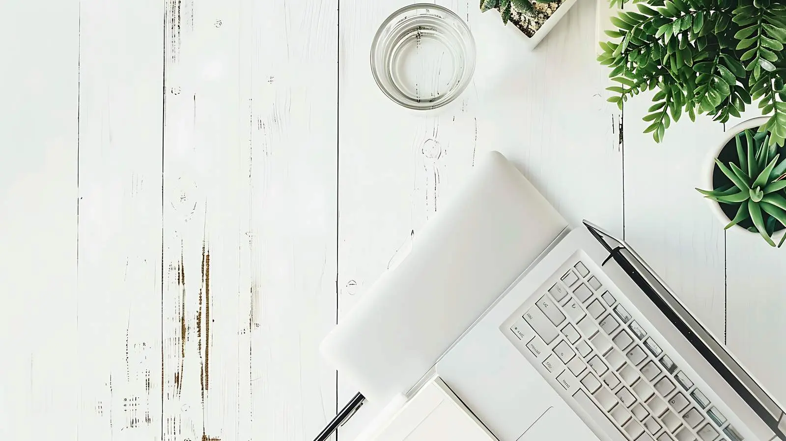 Laptop and Stationery on Wooden Table — free download from Dotvec
