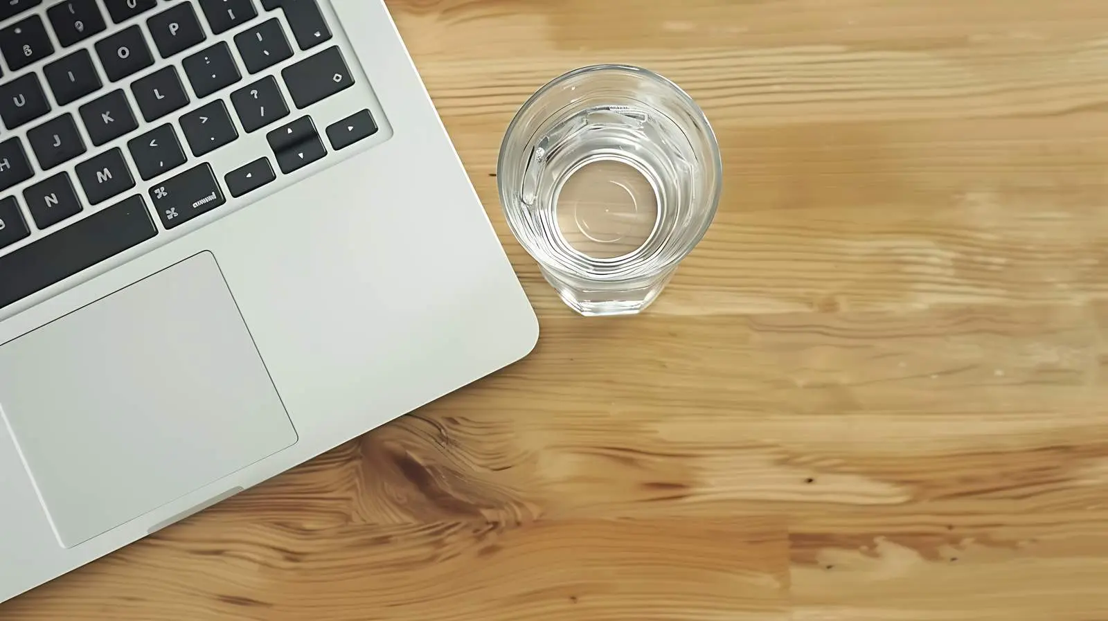 Laptop and Water on Wooden Table — free download from Dotvec
