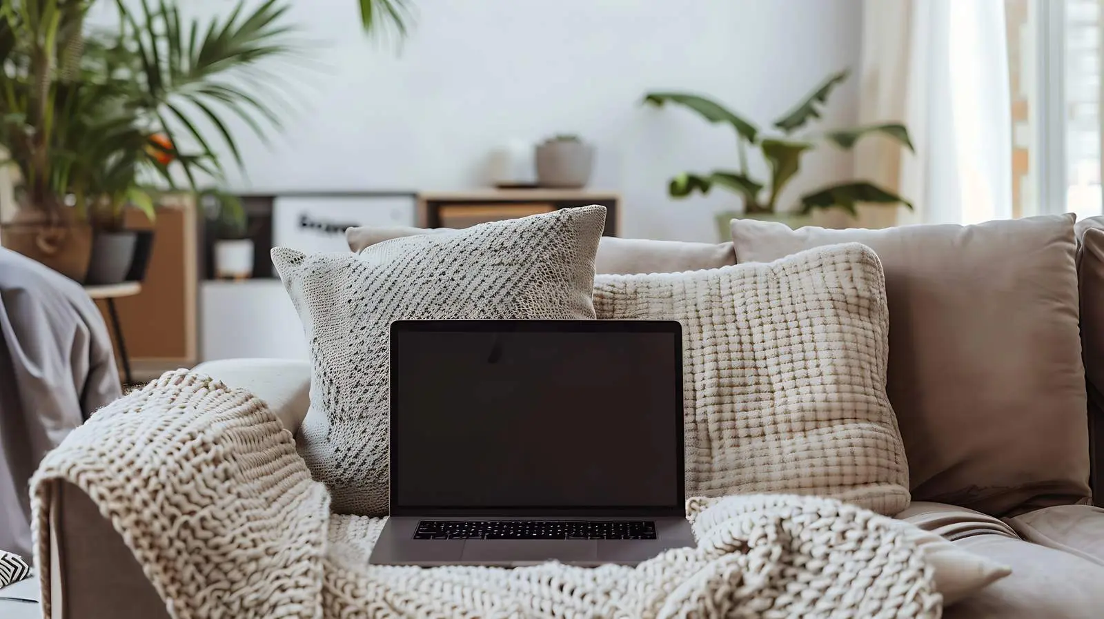 Elegant Laptop on Beige Sofa with Pillows — free download from Dotvec