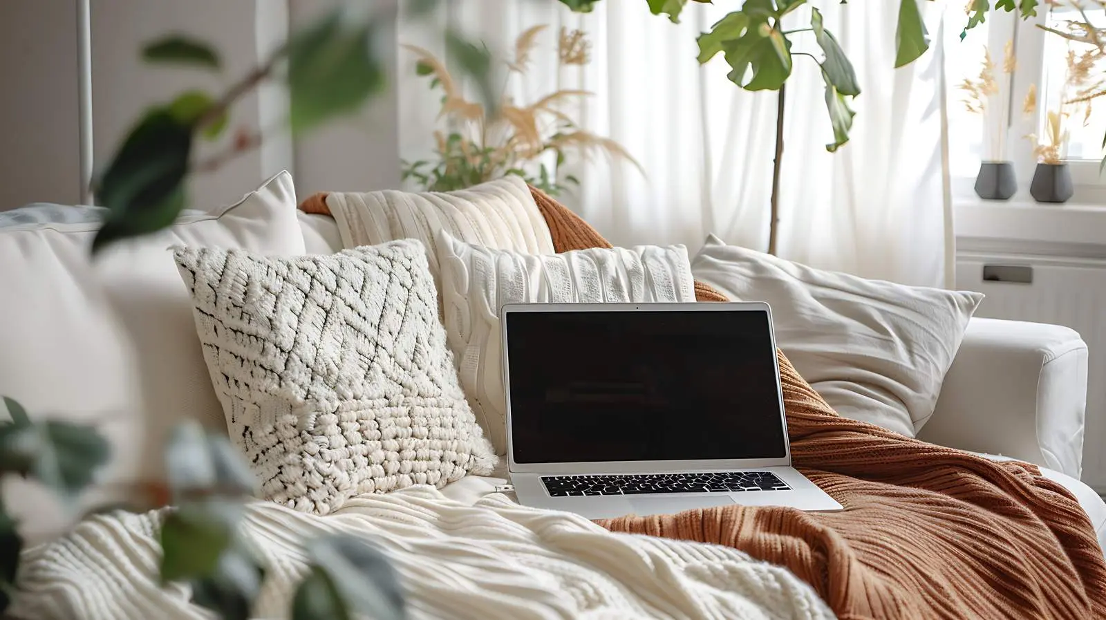 Laptop on Comfortable Sofa - Minimalist Top View – free tab image from Dotvec
