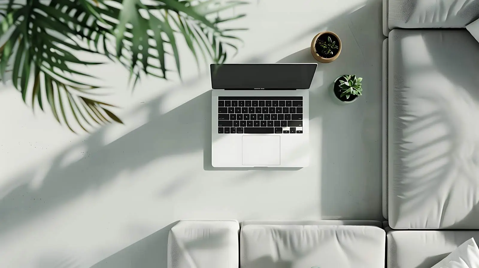 Laptop on Sofa - Minimalist Top View Image — free download from Dotvec