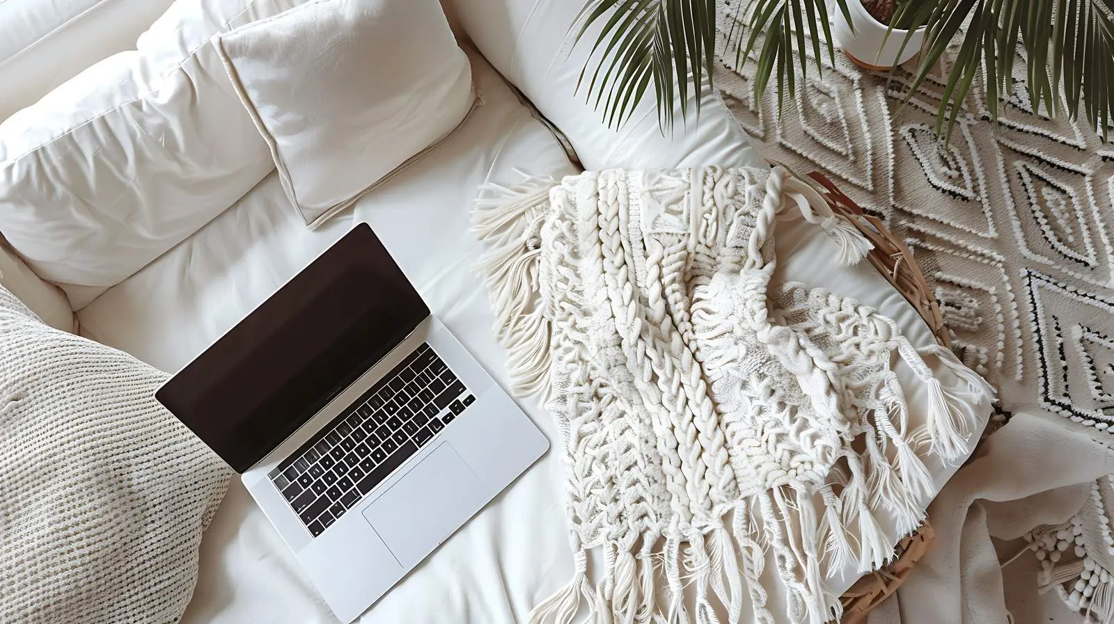 Laptop on Sofa - Minimalist Top View – free above image from Dotvec