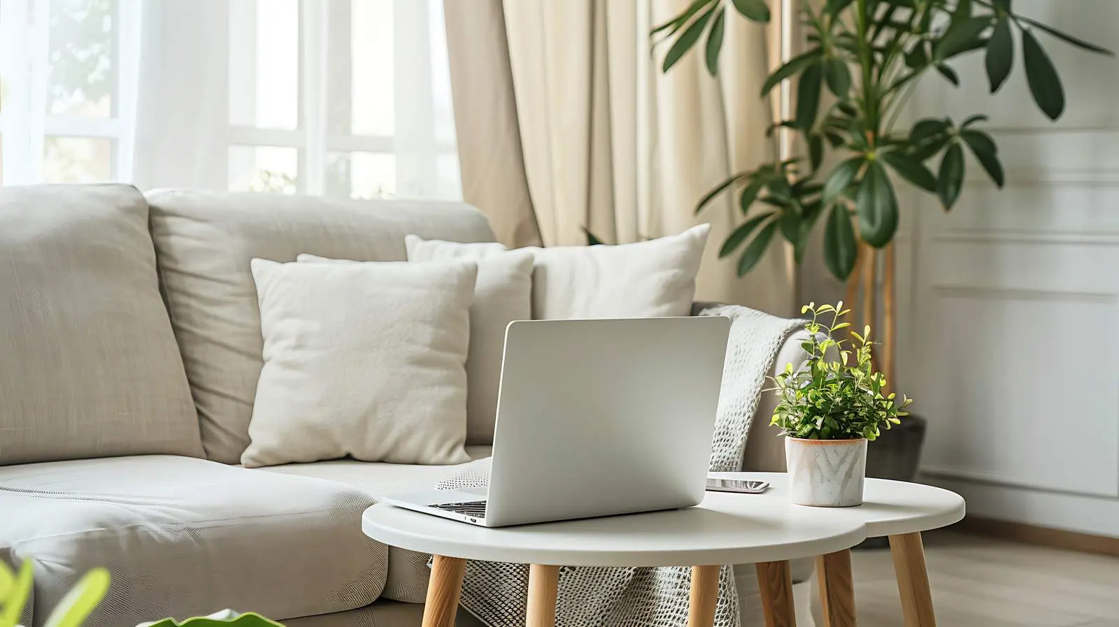 Laptop on Side Table by Comfortable Sofa — free download from Dotvec