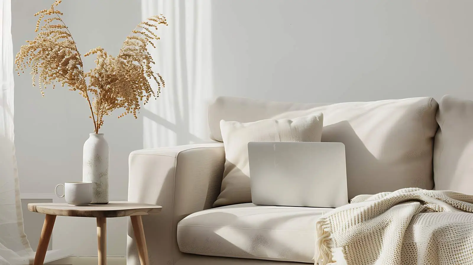 Laptop on Side Table by Cozy Sofa — free download from Dotvec