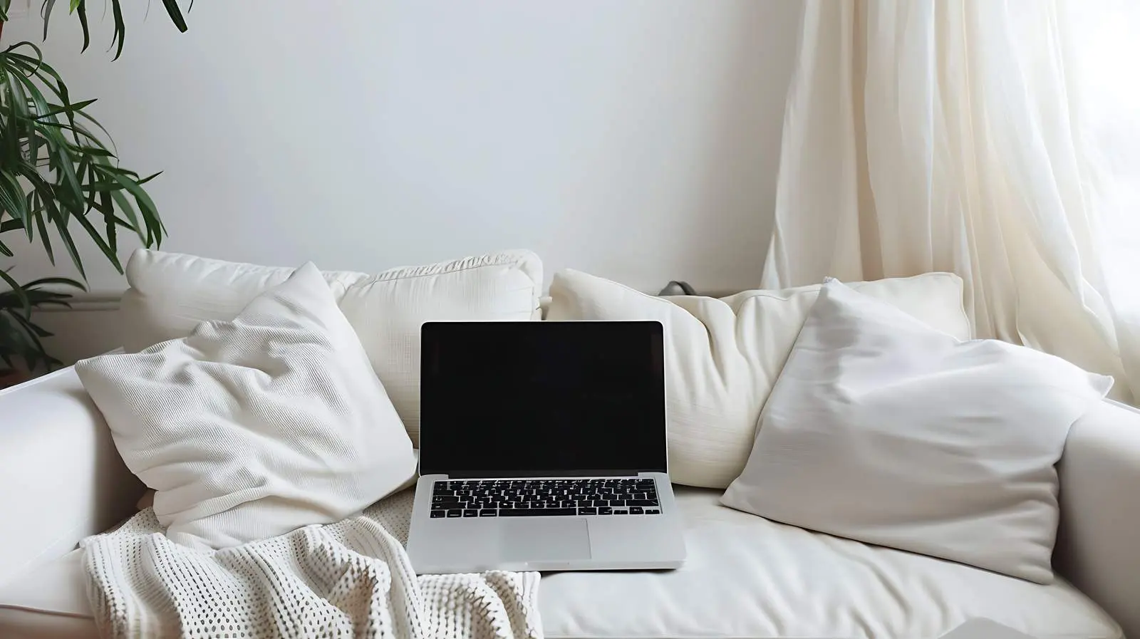 Laptop on Sofa for Home Office Setup – free cushions image from Dotvec