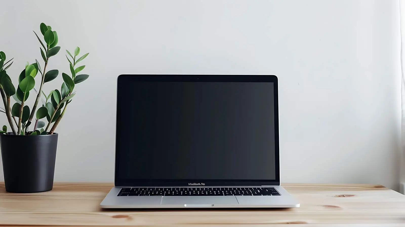 Laptop on Wooden Table with Blank Screen Space — free download from Dotvec