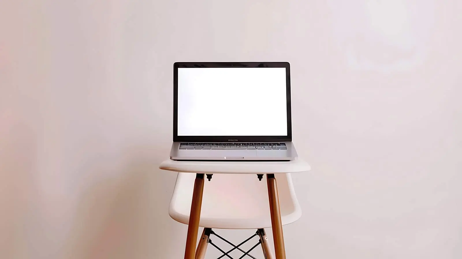Aesthetic Laptop on Chair with Blank Screen — free download from Dotvec