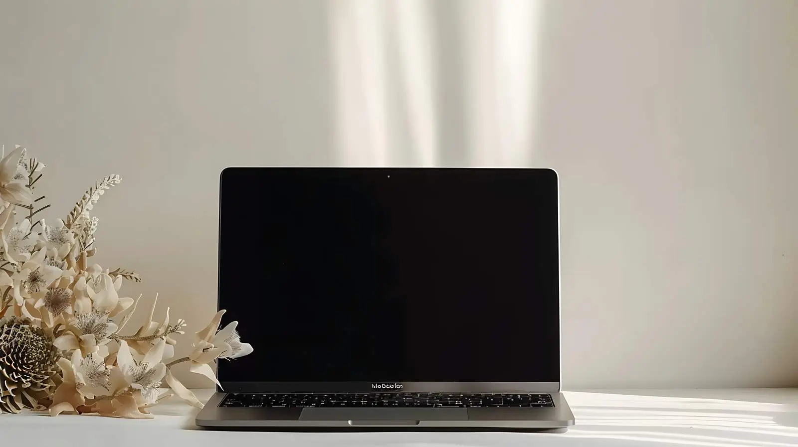 Laptop on Table with Black Screen and Flower — free download from Dotvec