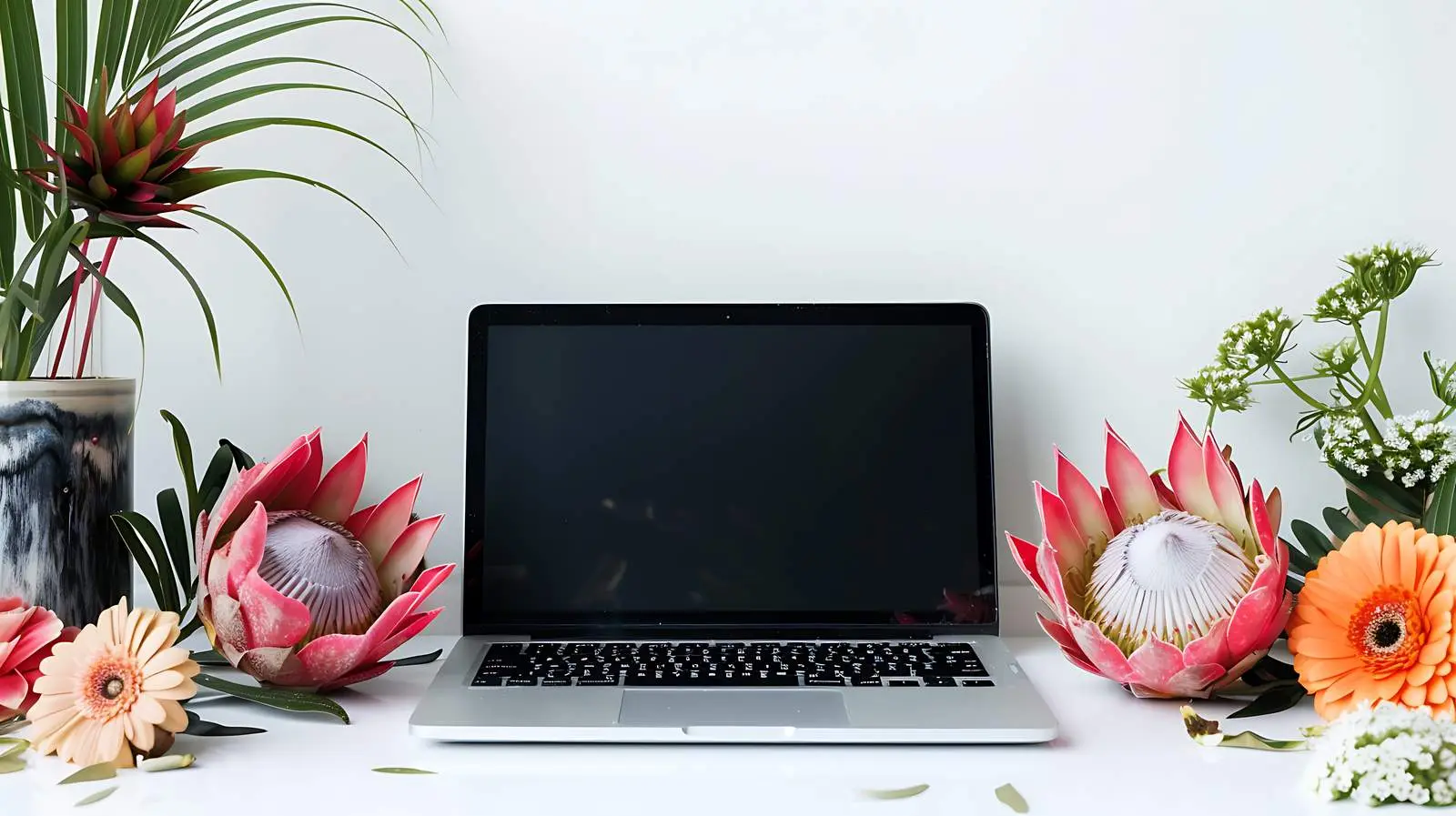 Laptop on Table with Proteus Flower — free download from Dotvec