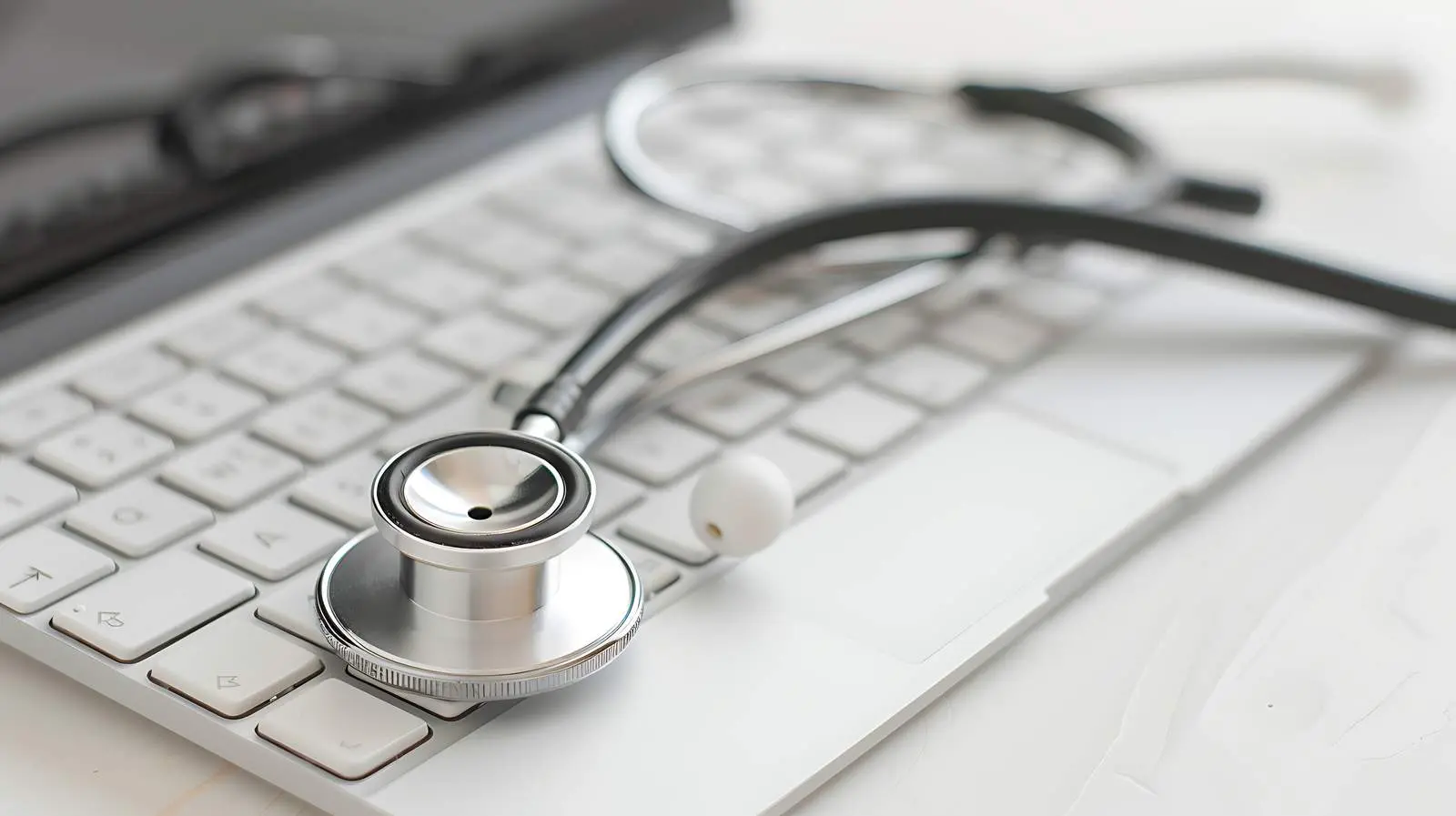 Stethoscope on Keyboard with Coffee Cup – free hospital setting image from Dotvec