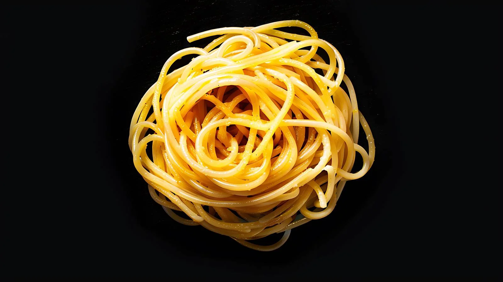 Savory Spaghetti Noodles on Black Background — free download from Dotvec