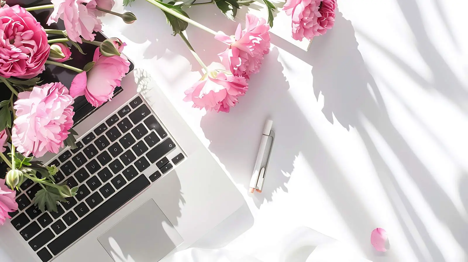 Notebook and Laptop in Sunlit Floral Setting — free download from Dotvec