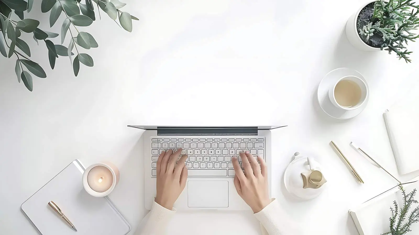 Person Working on Laptop in Aesthetic Home Office — free download from Dotvec