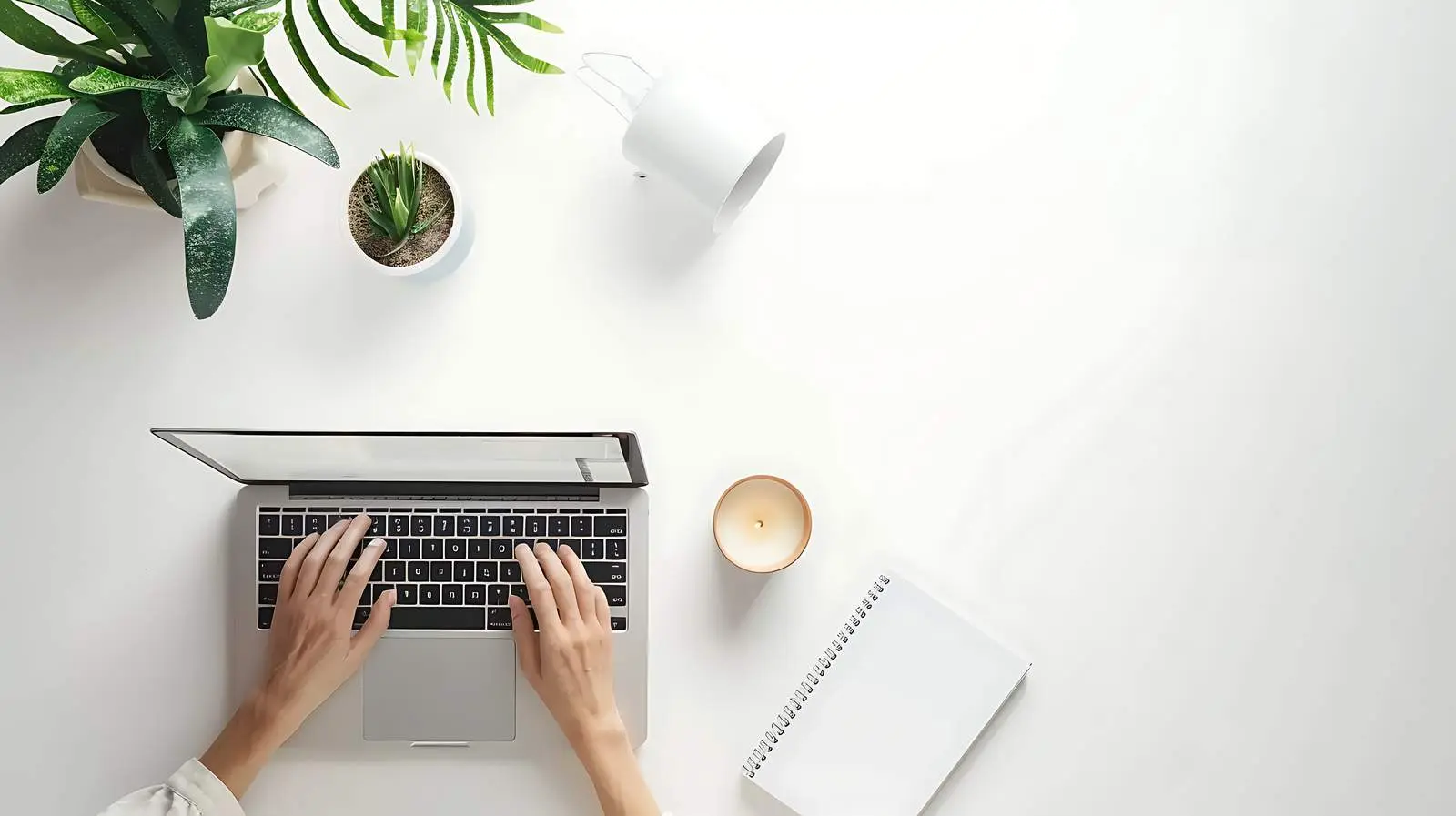 Person Working on Laptop in Aesthetic Home Office — free download from Dotvec