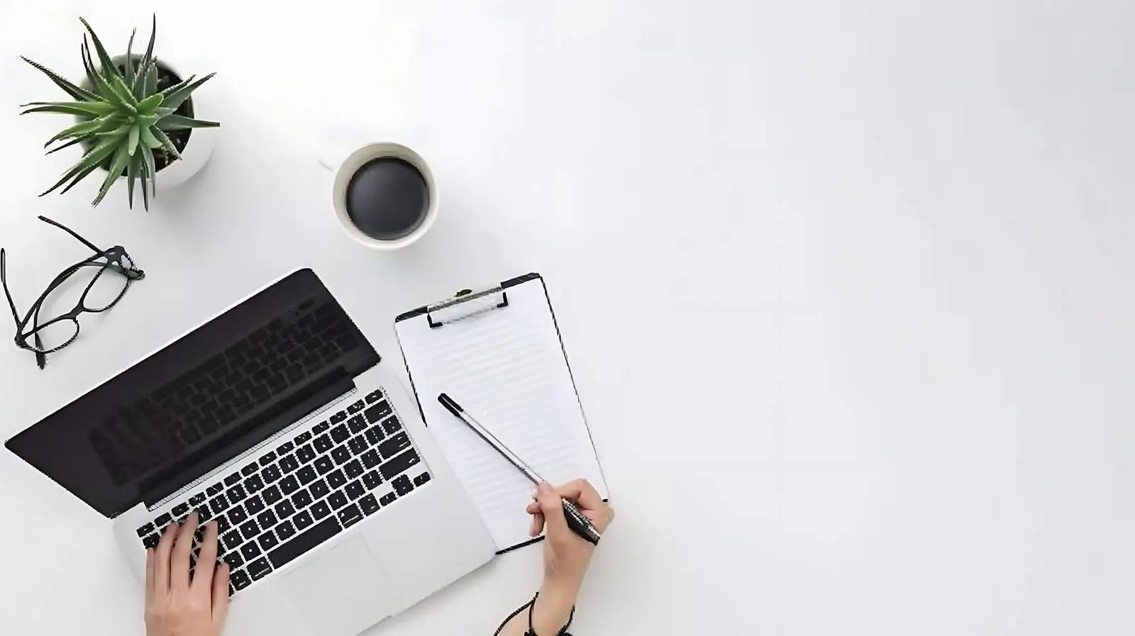 Person Writing or Drawing in Notebook — free download from Dotvec