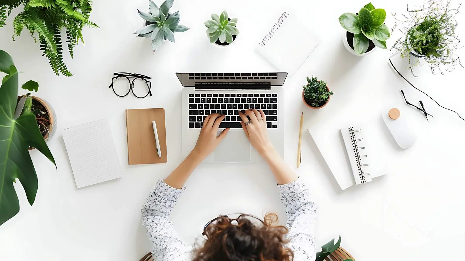 Person Writing or Drawing in Notebook — free download from Dotvec