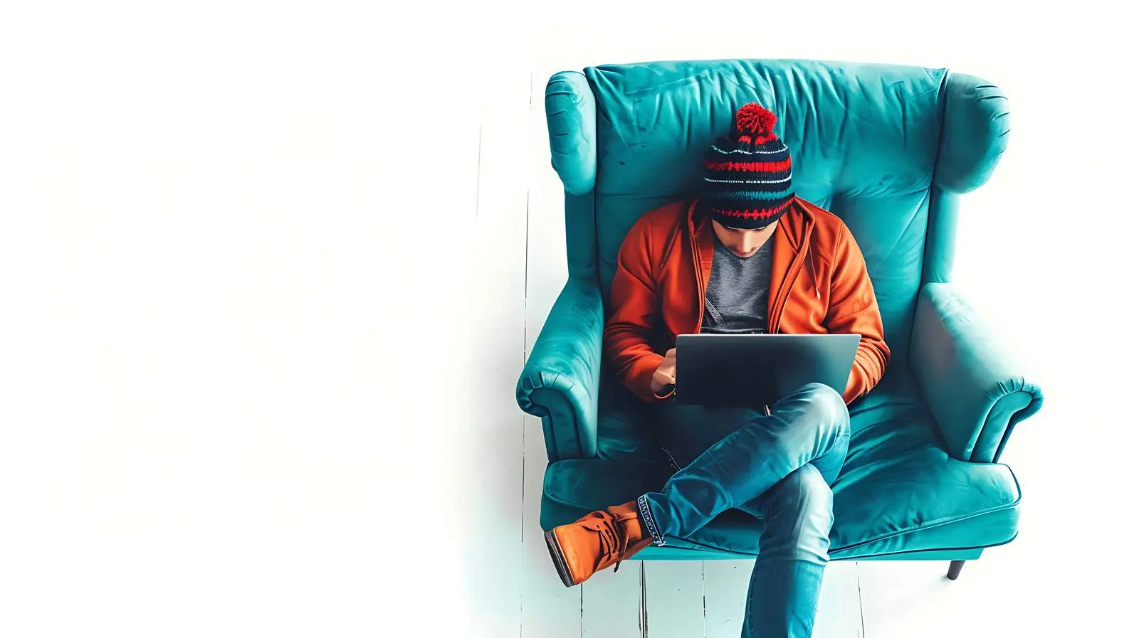 Person Working on Laptop in Lounge Chair — free download from Dotvec