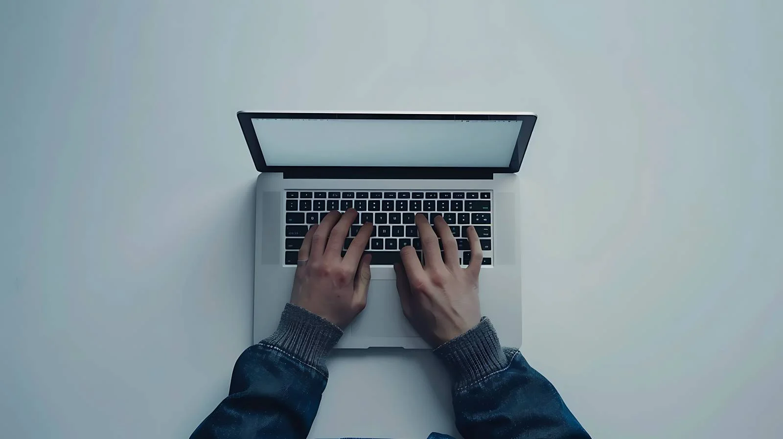 Focused Freelancer Working on Laptop — free download from Dotvec