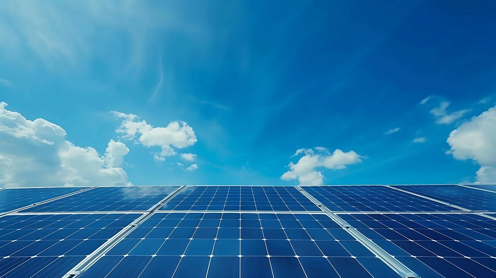 Solar panels against blue sky backdrop — free download from Dotvec