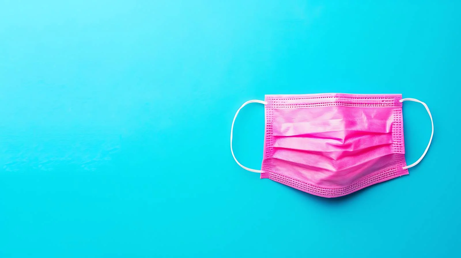 Pink Medical Face Mask on Blue Background — free download from Dotvec
