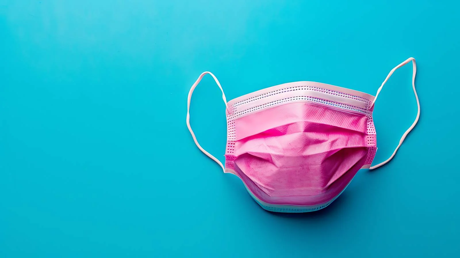 Pink Medical Face Mask on Blue Background — free download from Dotvec