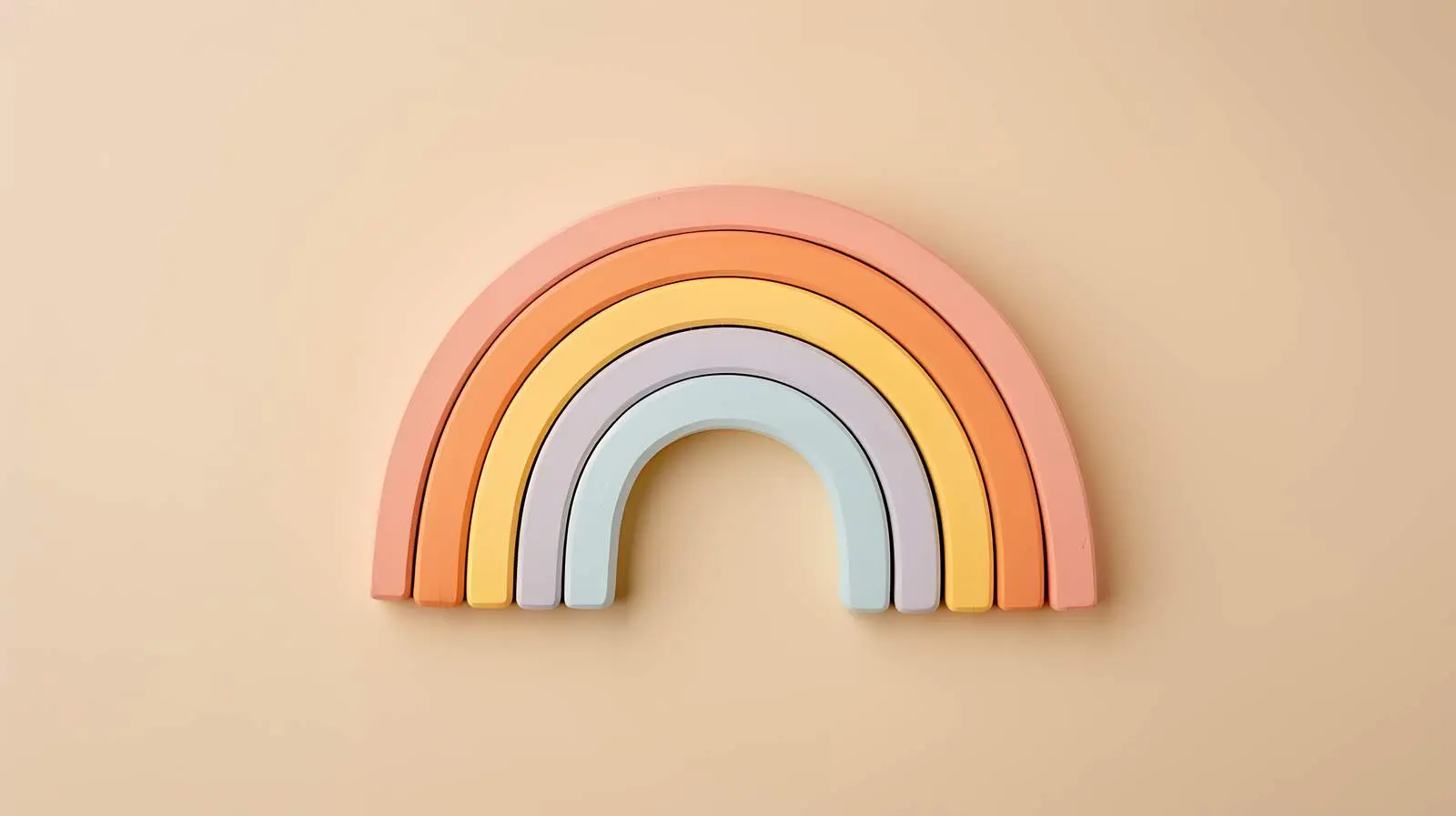 Colorful Rainbow Stacking Toy on Beige Background — free download from Dotvec
