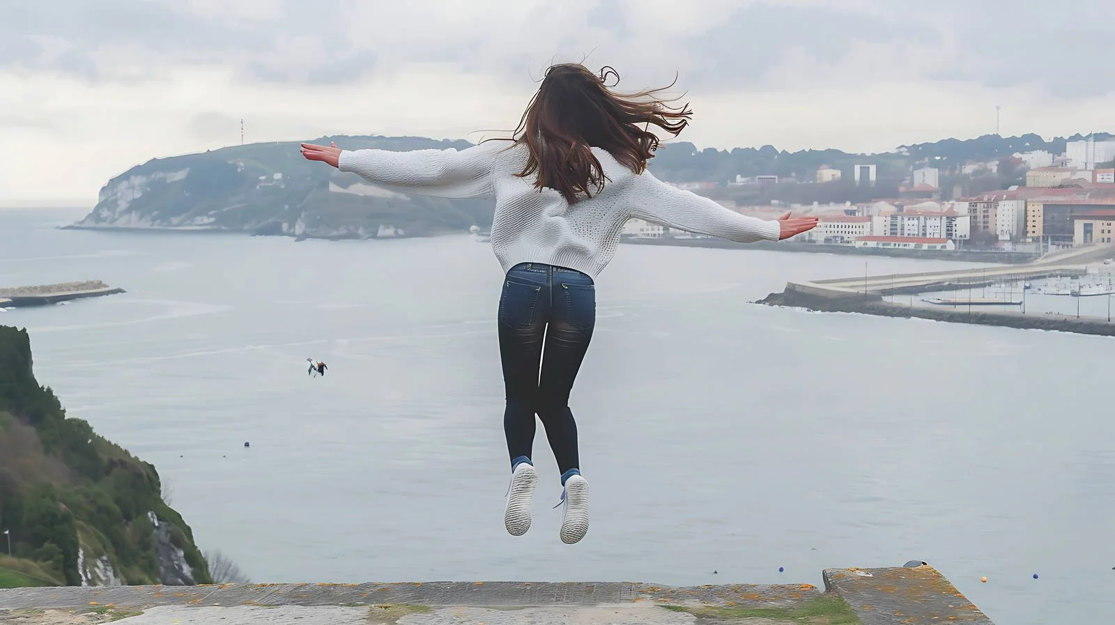 Exuberant Woman Jumping at Scenic Spot — free download from Dotvec