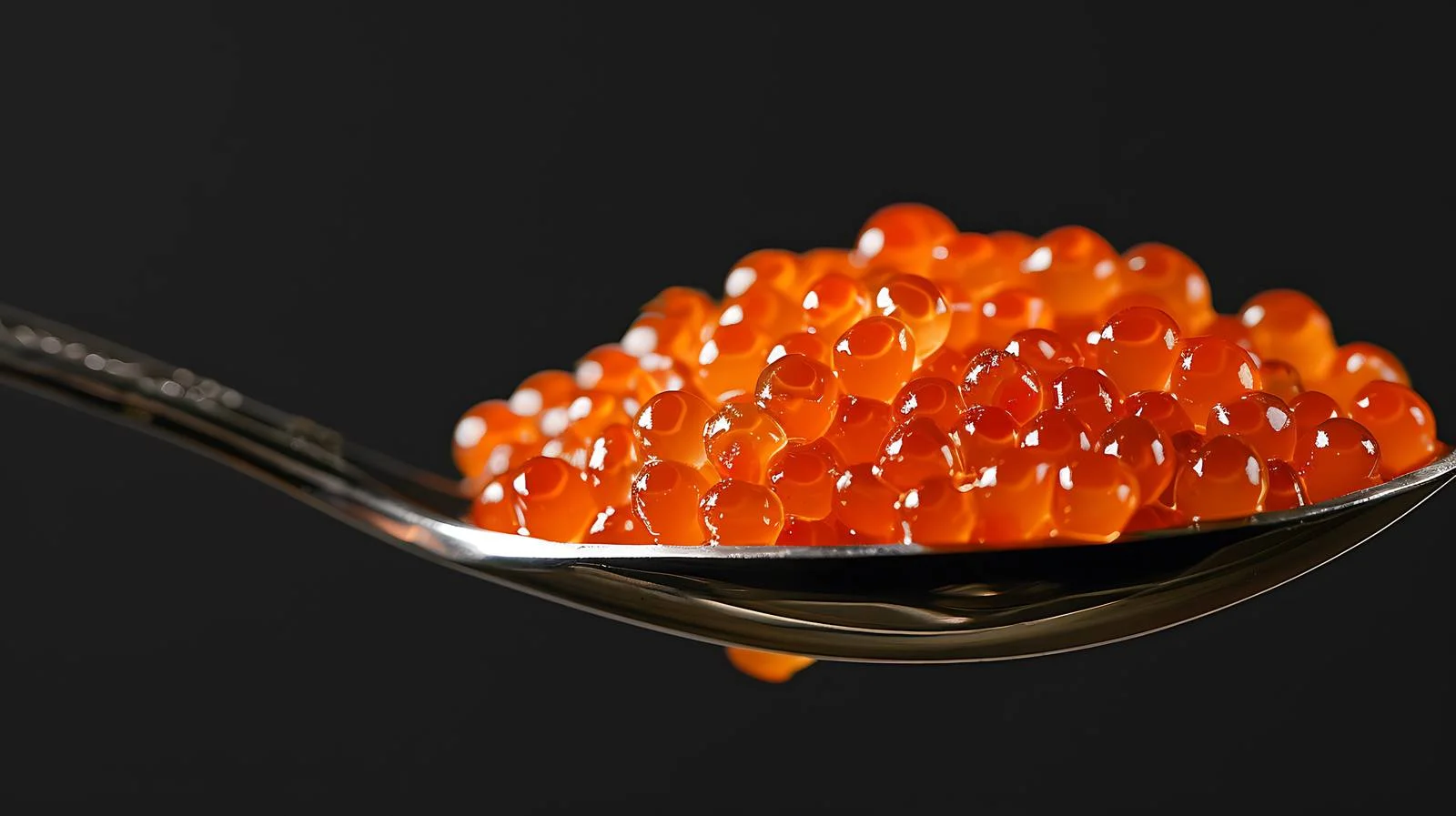 Exquisite Red Caviar on Black Background — free download from Dotvec