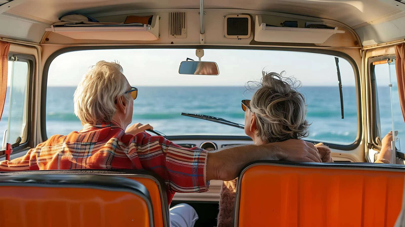 Elderly couple exploring in retro camper van — free download from Dotvec