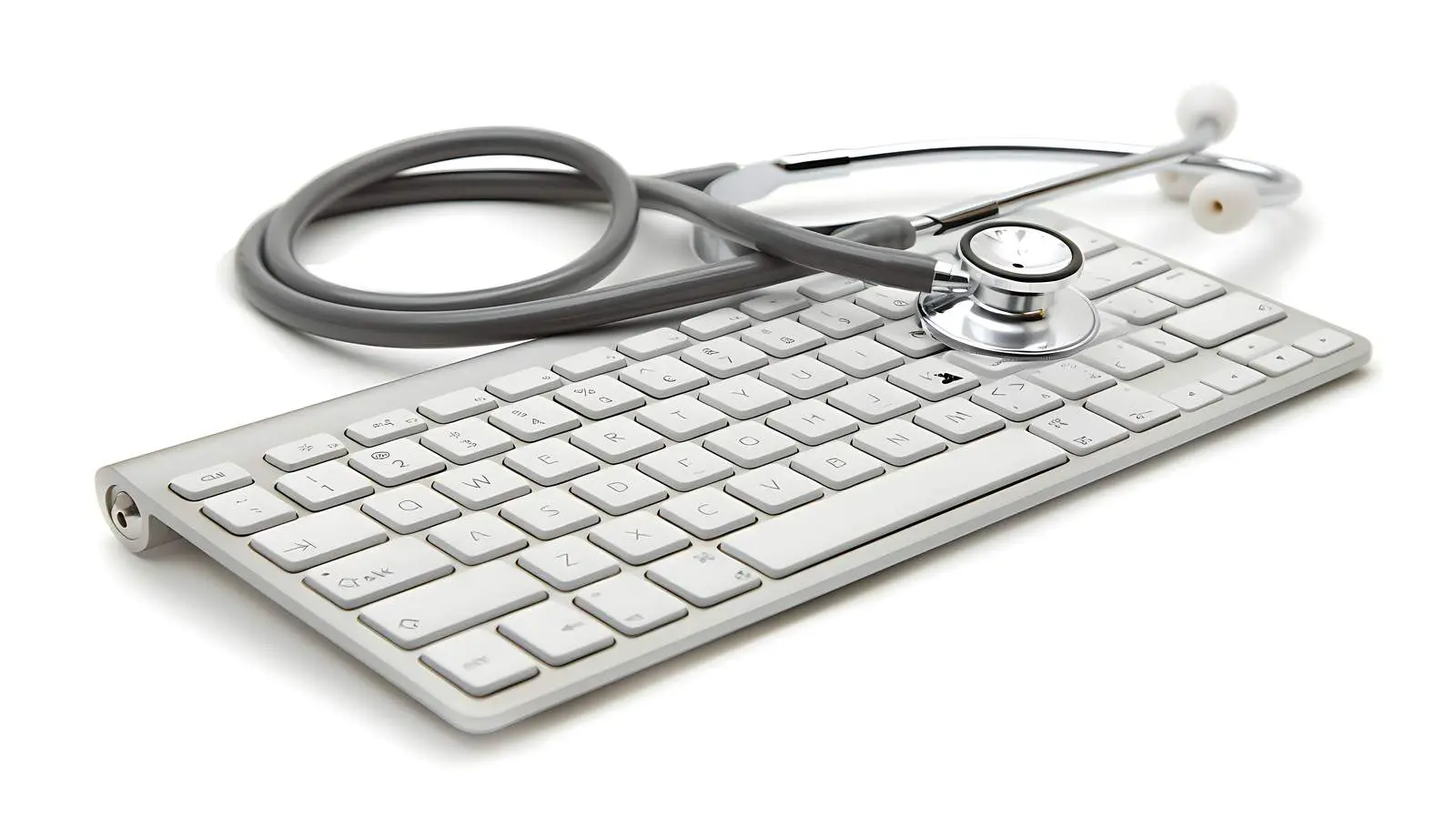 Silver Stethoscope on Keyboard Background – free audio image from Dotvec