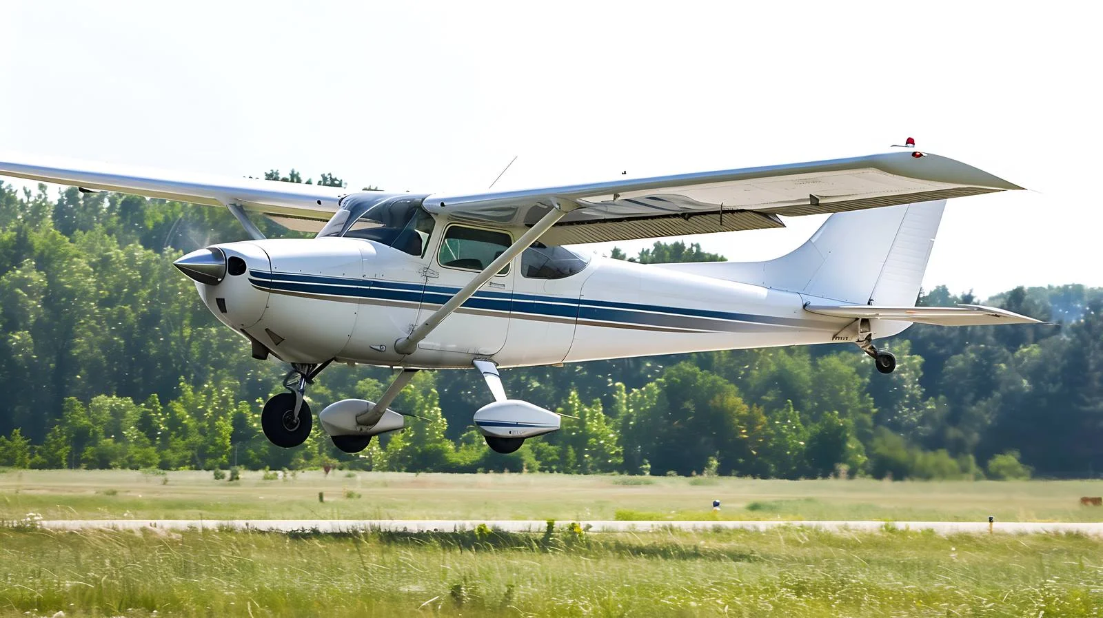 White single-engine aircraft taking off — free download from Dotvec